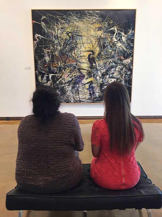 Dishman Art Museum -visitors admiring painting